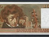 un gros plan sur un billet sur lequel figure la photo d'un homme