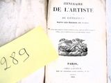 un vieux livre sur lequel est collé un autocollant jaune