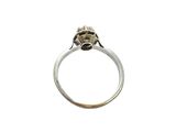 a close up of a silver ring with a flower on it
