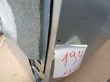a sign on the side of a refrigerator that says it is not open