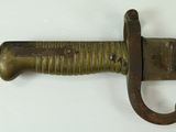 a knife that is hanging on a wall with a hook