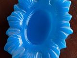 a blue bowl and a white plate on a table