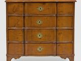 a wooden chest of drawers with brass hardware on the drawers