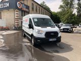 a white van that is parked in front of a building