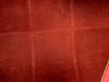 the inside of a red purse with a zipper on it