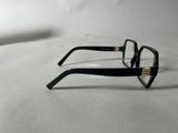 pair of black glasses on a white surface with a white background