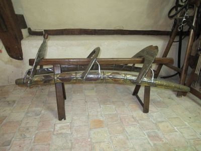a bench made out of wood and tools on the floor