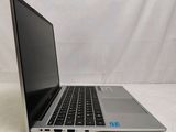 an open laptop computer sitting on top of a white surface