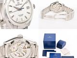 two watches and a watch box on a white background