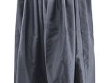 the skirt is black and has a zipper at the waist