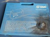a blue box with a sign on it sitting on a table