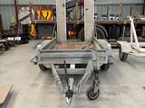 an image of a truck in a warehouse with a crane