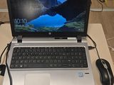 a laptop computer sitting on top of a desk with a mouse