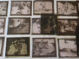 a lot of old black and white photos on the wall
