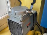 a small air conditioner sitting on a window sill