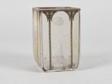 a glass vase with a silver rim and a glass base