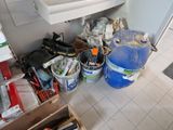 a picture of a bathroom with a sink and a lot of tools on the floor