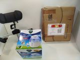 a box of toilet cleaner next to a chair and a box of toilet paper