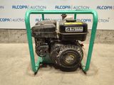 a small engine sitting on top of a green stand
