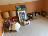 a picture of a living room with a picture on the wall