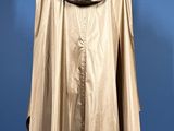 an image of a beige rain coat on a mannequin stand
