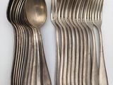 a lot of forks and spoons on the table
