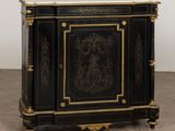 an image of a black and gold cabinet with a marble top