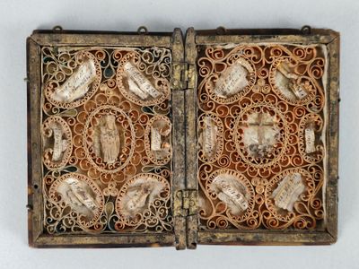 a wooden box with a decorative design on the inside