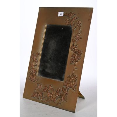 an image of a picture frame with flowers and leaves on it