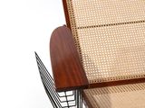 a chair that has a basket on the back of it