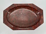 an image of a red marble tray on a white surface