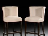 pair of upholstered bar stools with upholstered backrests