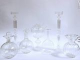 a lot of glass vases that are sitting on a table