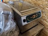 a bag of food sitting on top of a table next to a machine