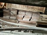 a pile of wood sitting on the floor in a room
