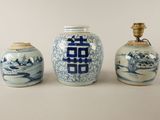 three blue and white vases sitting next to each other