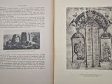 an open book with a picture of a building in it