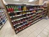 a lot of snacks on the shelves in the store