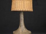 an image of a table lamp with a woven shade on it