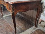 a wooden table with a wooden top on a hard wood floor