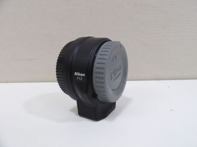 a camera lens sitting on top of a white table