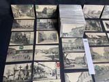 a lot of old black and white photos on the table