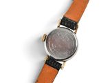 an image of a wrist watch with a silver face and a brown leather strap