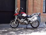 two motorcycles parked next to each other on the street