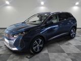 a blue 2020 hyundai kona hybrid suv parked on a checkered floor