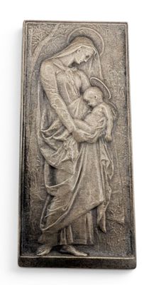 an image of a pewed plaque depicting a woman holding a baby