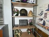 a shelf with a bunch of flowers on top of it
