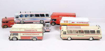 five toy buses and a bus on a white surface