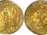 a gold coin with a depiction of a man and a woman on it