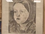 a drawing of a little girl in a bonnet on a easel